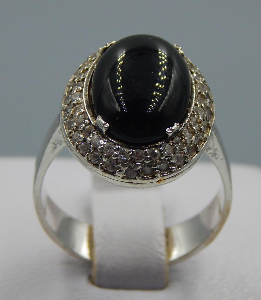 Серебряное кольцо с ониксом и цирконием (32417946) 0
